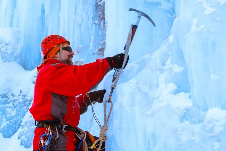 Ice climber with mountaineering axe