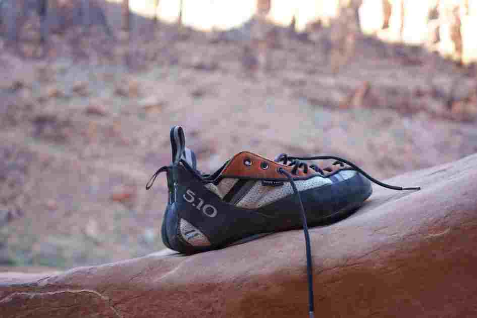 Five Ten climbing shoe placed on a rock, ideal for bouldering beginners looking for high-performance gear.